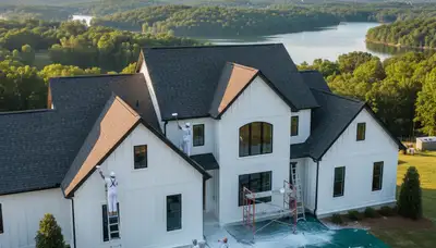 Professional house painters working on residential exterior in Knoxville, TN