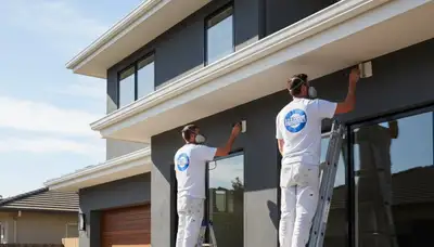 Professional trim and fascia painting on a Knoxville TN home by expert house painters